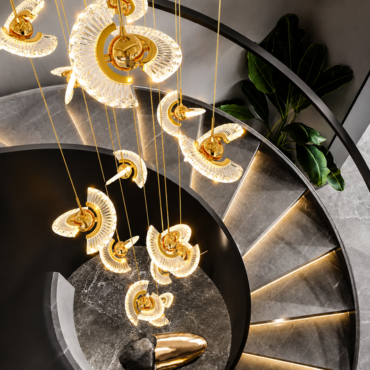 Decorative ceiling light fixture with gold and clear elements in a modern interior setting.