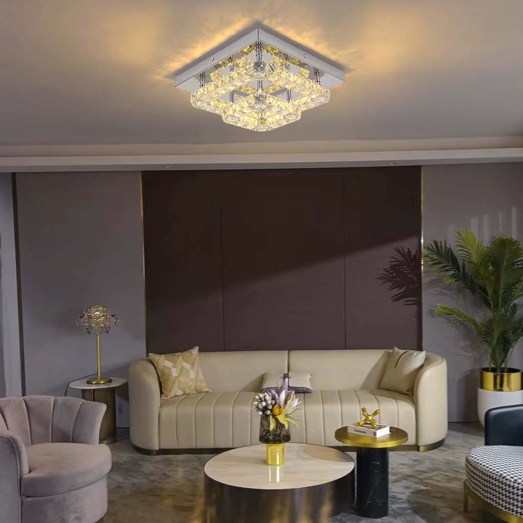 Modern living room with a ceiling light fixture, sofa, and decorative elements.