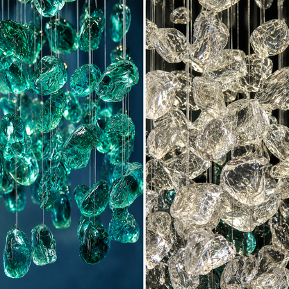 Close-up of teal and clear crystal chandelier against a dark background
